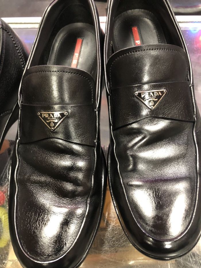Black designer loafers after new soles and a shine